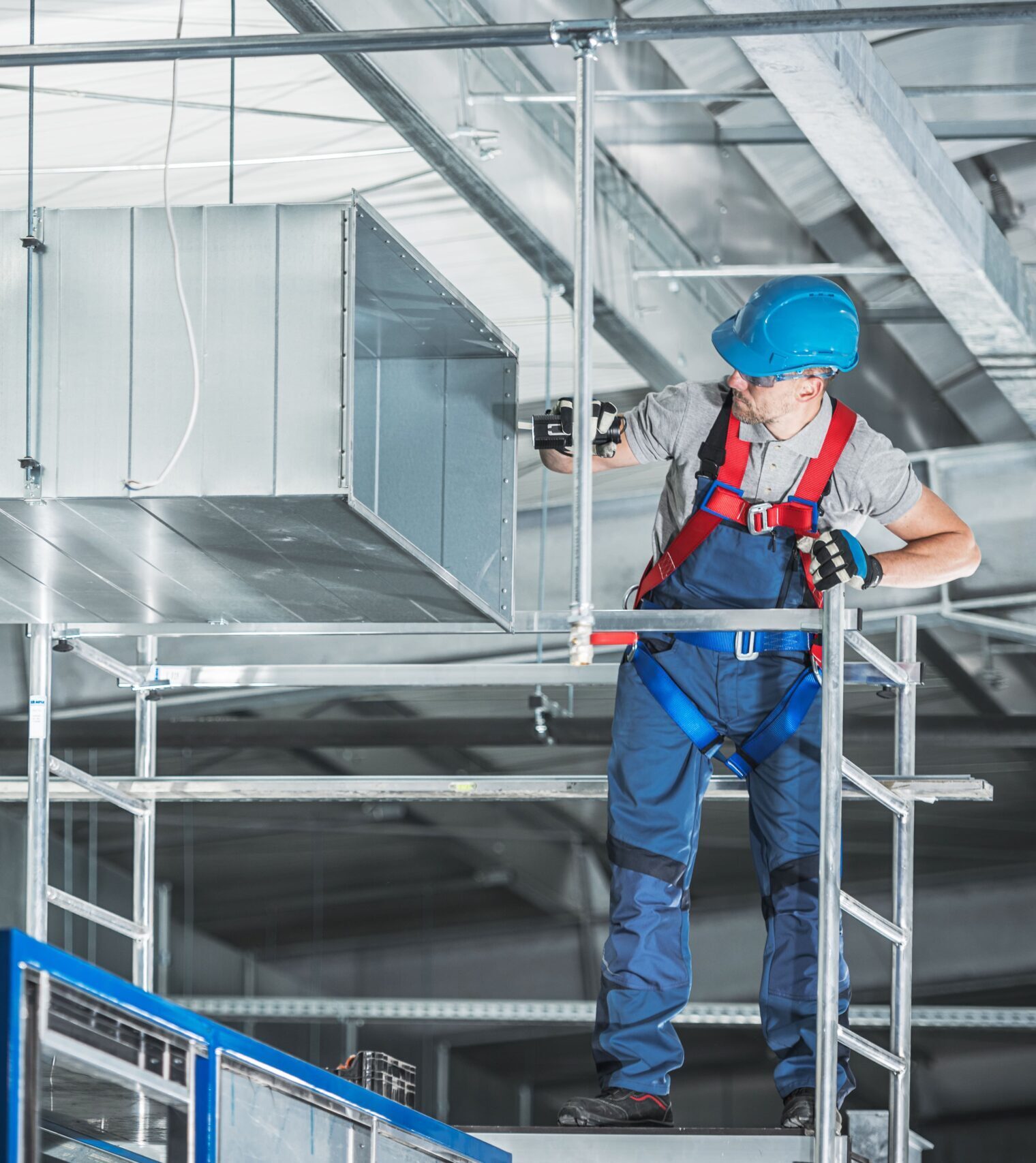 YXE technician cleaning commercial HVAC ductwork in a Saskatoon building